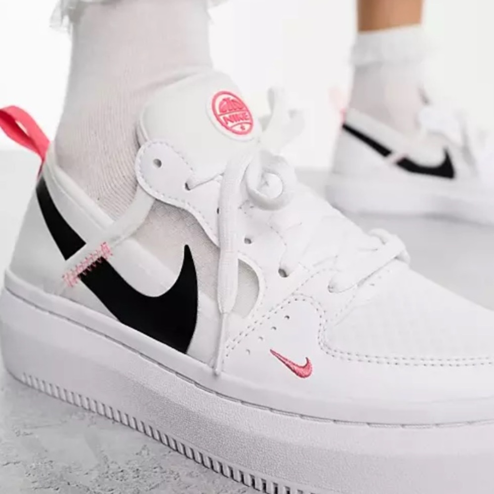 Used but in GREAT condition: Nike White and Black Sneakers with Pink Accents